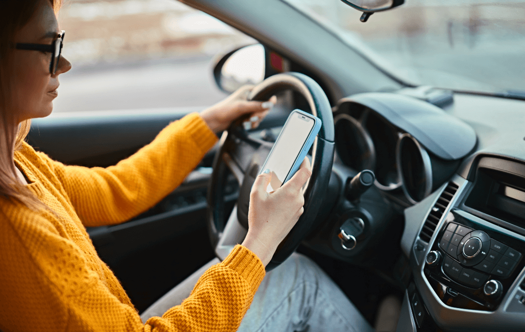 Woman on cell phone while driving